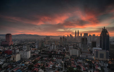 Cityscape against sky during sunset