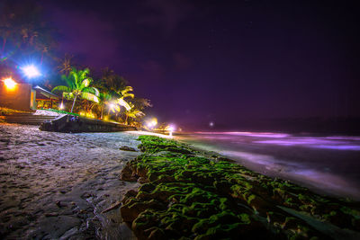 Illuminated street light at night