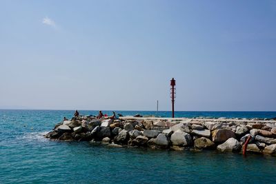 Scenic view of sea against clear blue sky