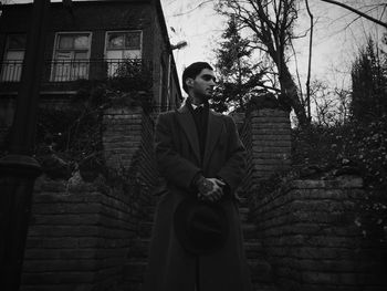 Man standing in front of building