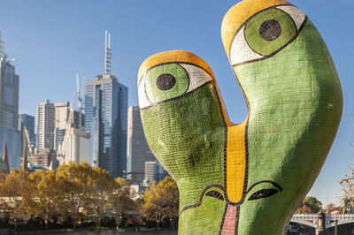 Sculpture of modern buildings against sky