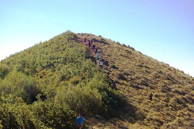 Low angle view of mountain against blue sky