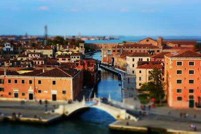 High angle view of buildings and canal against sky