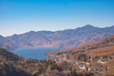 Scenic view of mountains against clear blue sky