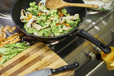 High angle view of food in cooking pan on stove