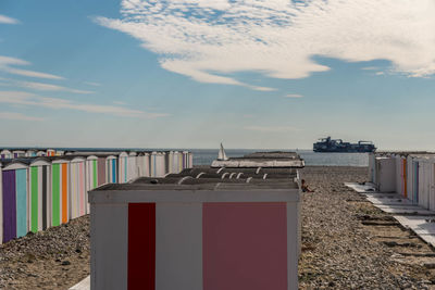 Lifeguard hut on beach against sky