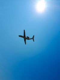 Low angle view of airplane flying in sky