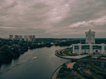 High angle view of road by buildings against sky