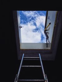 Low angle view of window against sky