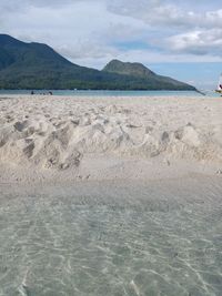 Scenic view of beach against sky