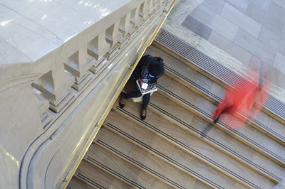 High angle view of person walking on staircase