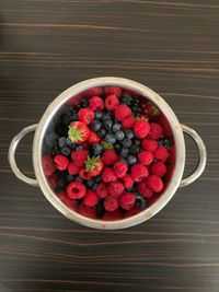 High angle view of strawberries in bowl on table