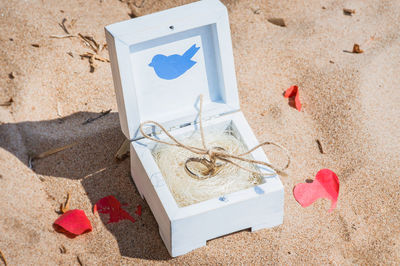 High angle view of heart shape on sand