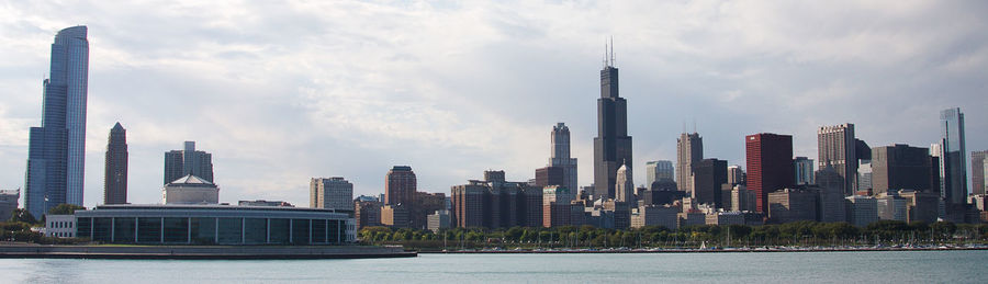 Panoramic view of modern buildings in city against sky