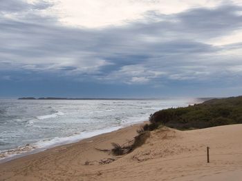 Scenic view of beach against sky