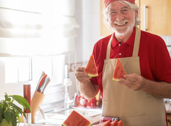 Portrait of smiling man holding ice cream