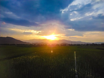 Scenic view of landscape against sky during sunset