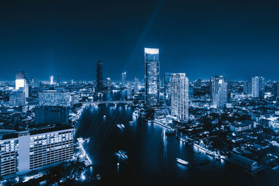 Illuminated buildings in city at night