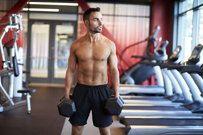 A man working out in the gym.