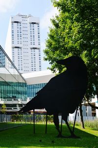 Gazebo in park against sky in city