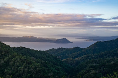 Scenic view of mountains against sky at sunset