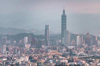 Modern buildings in city against sky