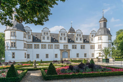 Panoramic view of trees and buildings against sky