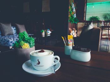 Close-up of coffee cup on table at home