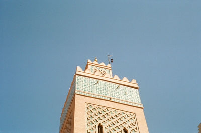 Low angle view of building against clear blue sky