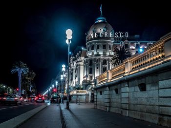 Illuminated cathedral against sky at night