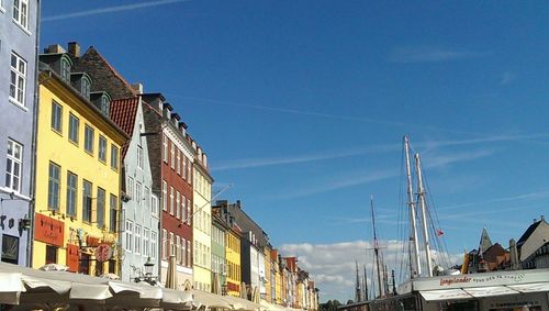 Buildings against blue sky and clouds