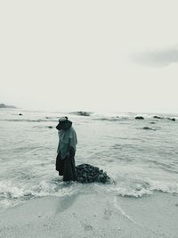 Lonely woman on the beach