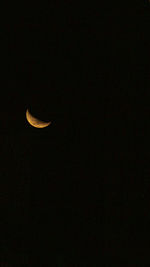 Low angle view of moon in sky at night