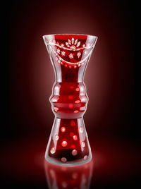 Close-up of red light over black background