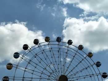 Low angle view of ferris wheel against sky