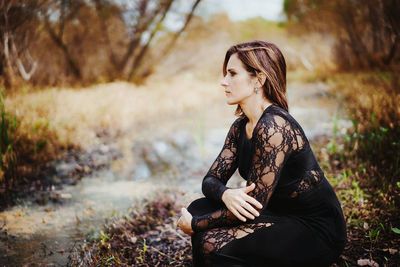 Young woman sitting outdoors