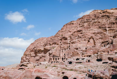 Low angle view of rock formation against sky