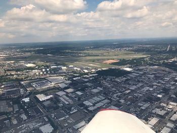 Aerial view of cityscape against sky