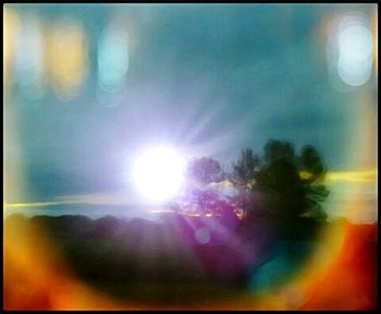 Defocused image of silhouette man against sky