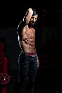 Young man exercising in gym