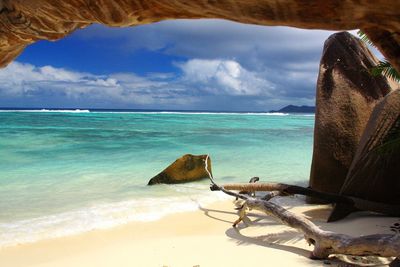 View of beach against cloudy sky