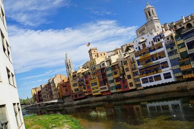 Buildings in city against sky