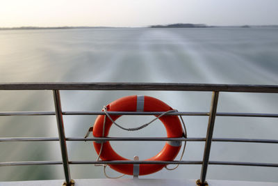 Close-up of boat on sea against sky