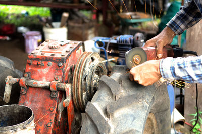 Man working on metal machine