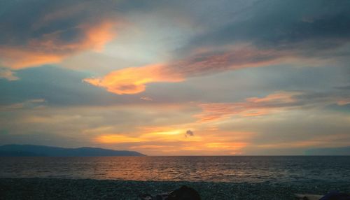 Dramatic sky over sea during sunset