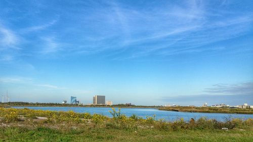 Scenic view of landscape against blue sky