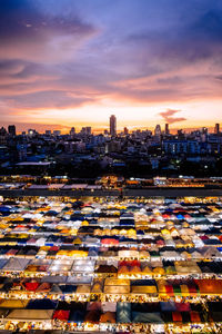 High angle view of buildings against sky at sunset