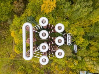 Directly above shot of industry by trees