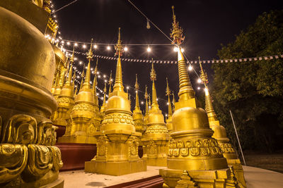 Low angle view of illuminated lanterns outside building