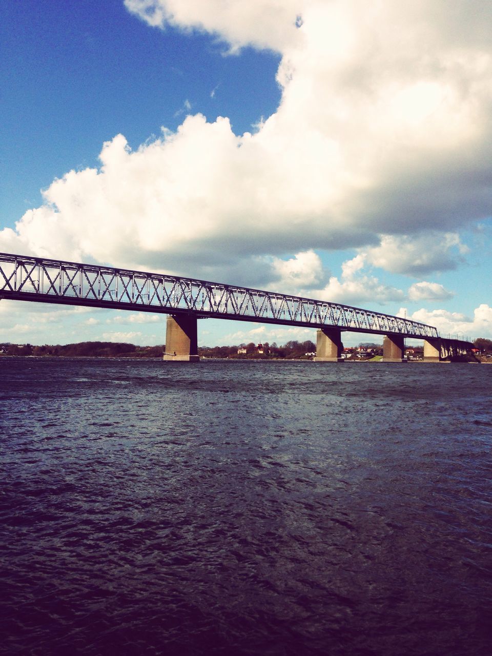 bridge - man made structure, connection, cloud - sky, sky, built structure, engineering, transportation, architecture, river, water, bridge, no people, travel, outdoors, nature, low angle view, day, travel destinations